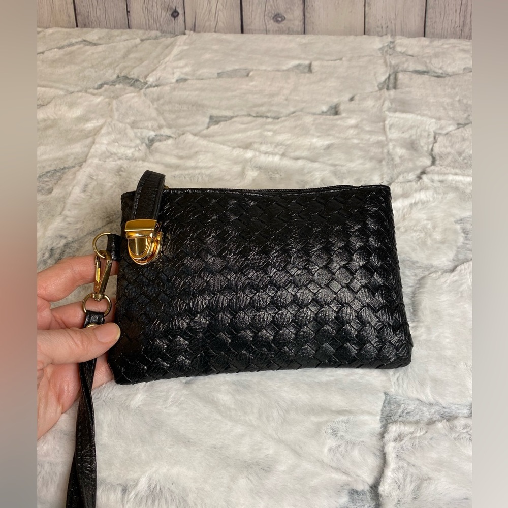 Small woven bag. Black with removable wristlet strap.